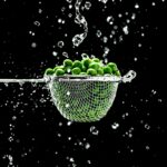 green fruits in strainer